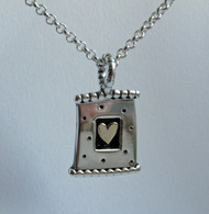 silver and gold heart pendant