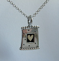 silver and gold heart pendant