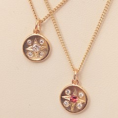 Gold and diamond compass necklace