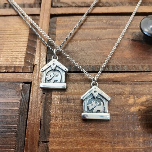 Little doggie in kennel pendant