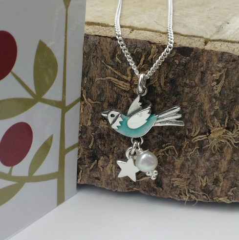 Aqua blue flying bird pendant