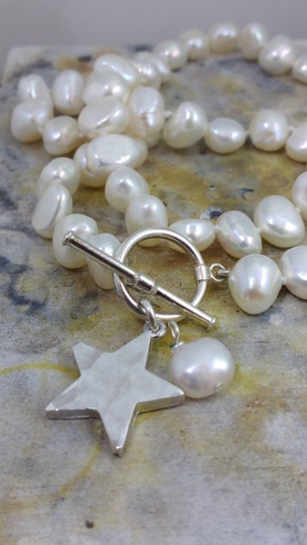 White freshwater pearl and hammered Star necklace