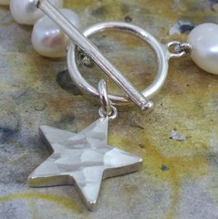 White freshwater pearl and hammered Star necklace