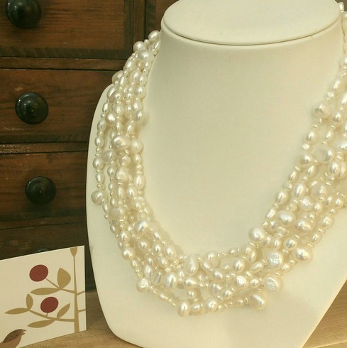 Six strand natural white freshwater and seed pearl necklace